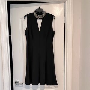Elegant Black Sleeveless Dress with Embellished Collar, Front/Back V-neck
